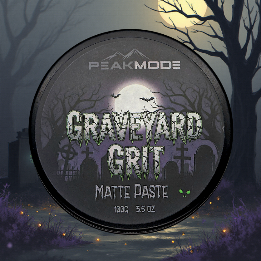 Jar of 'Graveyard Grit' matte paste with a Halloween-themed design against a spooky forest background.