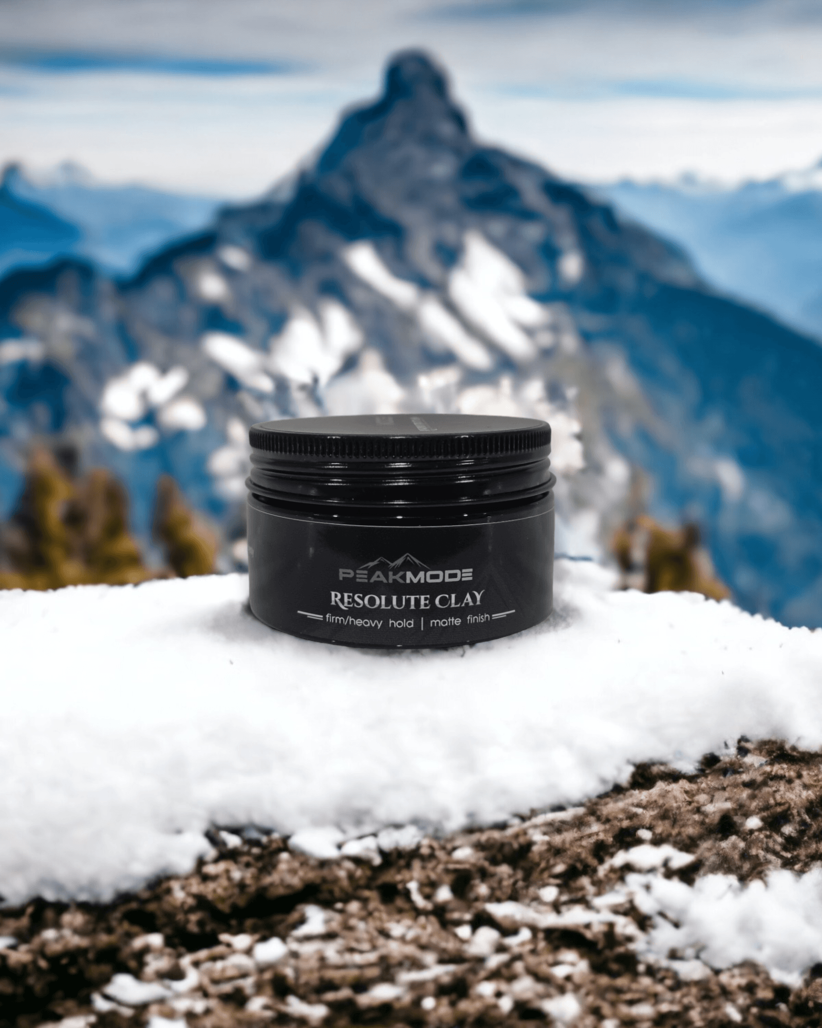 Cozy Elegance for the Season. Chic Winter Hair Looks for Long and Short Hair 12 https://www.thepeakmode.com/cdn/shop/products/peakmode-resolute-clay-for-men-jar-on-snow-mountain-background.png?v=1749802585&width=1946